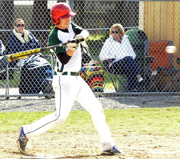 Marysville Getchell's Austin Richbourg taking a swing at an Arlington pitch.