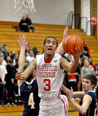 M-P senior guard Dominique Kiblinger takes the ball to the basket against Arlington at Marysville-Pilchuck High School on Jan. 24.