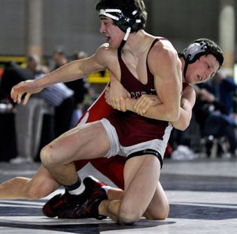 M-P senior Marcus Haughian takes down opponent Joel Ragazzo of Bethel in a 189-pound match.