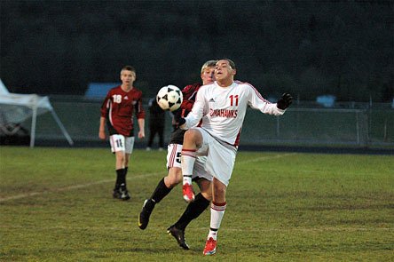 Marysville-Pilchuck senior midfielder Emmanuel Moreno fights to control possession with a Snohomish defender on his back.