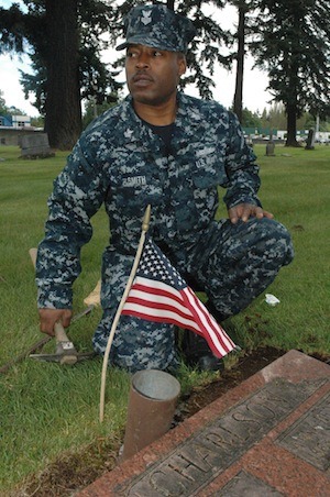 Electrician's Mate 1st Class Richard Smith surveys the number of veterans' graves at the Marysville Cemetery