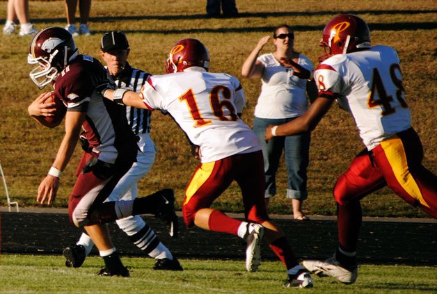 Lakewood receiver Justin Peterson beats two Prairie defenders to score one of his three touchdowns.