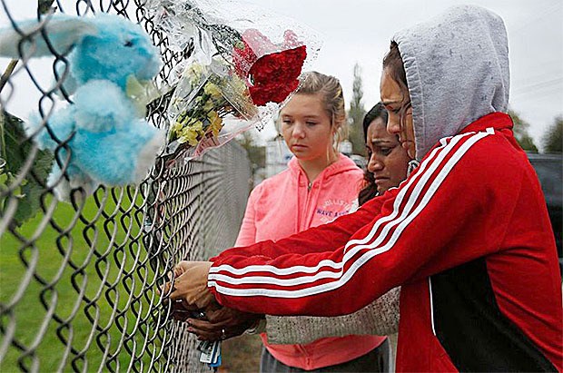 Community members show support for Marysville-Pilchuck High School Oct. 25 by putting flowers