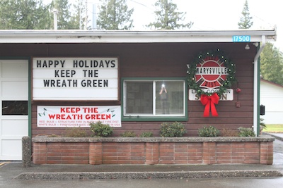 Marysville firefighters hope the city's citizens will help them 'Keep the Wreath Green' at their fire stations through the end of the year.