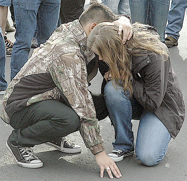 Two students console each other after the shooting at Marysville-Pilchuck High School's cafeteria Oct. 24. The gunman killed a female