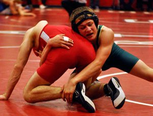 Marysville Getchell’s Daniel Knowlton takes down Marysville-Pilchuck’s John Schrock during the Wesco 3A District Tournament at Stanwood High School on Feb. 2.