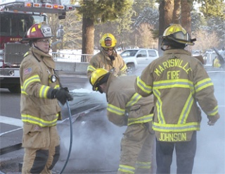 Marysville firefighters respond to an accident at the intersection of 88th Street and State Avenue Dec. 15.