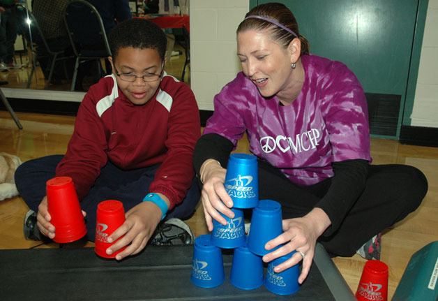 Josiah Frank and Jessica Callagan practice competitive cup-stacking at the Marysville YMCA April 28.