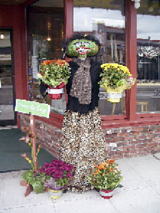 “Resfucha” wins $100 as the first place winner of the Arlington Arts Council’s Scarecrow Contest in downtown Arlington. She was entered by Flowers by George.