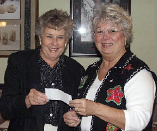 Soroptimist of Marysville President Carol Biegler met with the Operation Marysville Community Christmas committee to present a check for $2