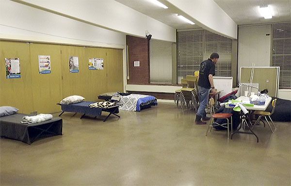 Dusty Stogdell and his cat Zander settle in at the new St. Mary's Catholic Church homeless shelter