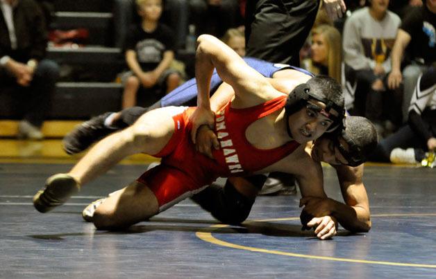 Marysville-Pilchuck junior 126-pounder Israel Lopez tries to shake off Arlington junior Jared Brock-Anderson.