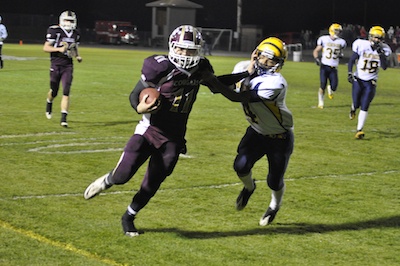 Lakewood junior quarterback Justin Peterson stiff-arms Burlington-Edison safety Jae Evans on the way to the end zone in Lakewood's 55-0 2A District playoff win on Nov. 5.