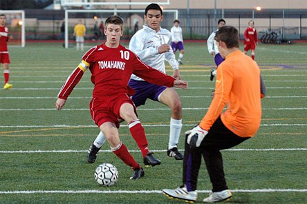 Brady Ballew puts the ball past Oak Harbor's keeper for his third of five goals that match.