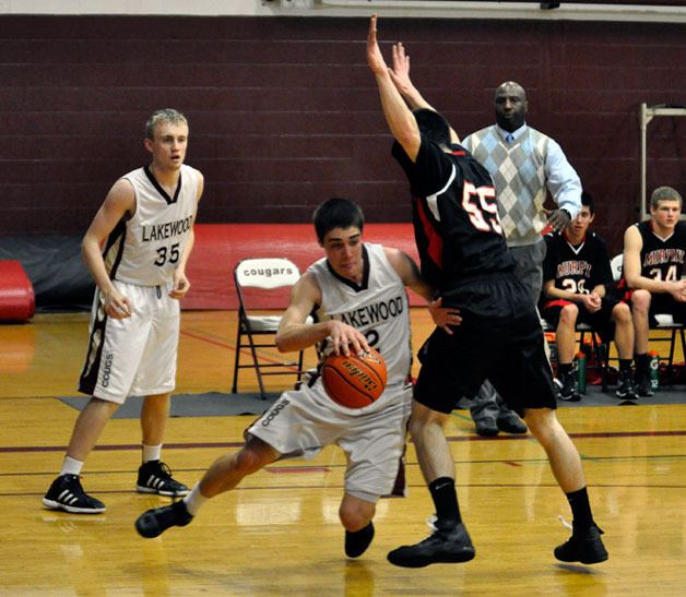 Lakewood senior guard Caleb Graves drives to the baseline against Archbishop Murphy senior forward Anker Anderson.