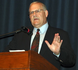 Emergency services consultant Don Bivens outlines options for regionalization to members of 14 fire districts in the Linda M. Byrnes Performing Arts Center on Aug. 30.