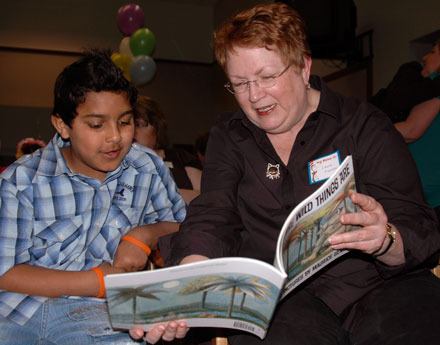 Kellogg Marsh Elementary student Haroon Younis reads from “Where the Wild Things Are” with his pen pal