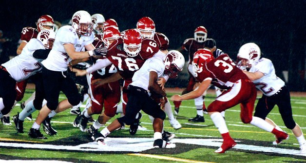 M-P defensive end Calvin White makes a tackle for a loss against Cascade.