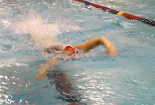 The Marysville-Pilchuck swim team competes in the 400 freestyle relay at preliminaries where the team took 20th place in a time of 3:54 flat.