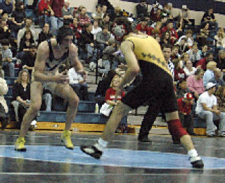 Max Scherf wrestled 12 minutes and then some as he won both of his matches including an overtime win as Arlington faced Meadowdale and Lynnwood.