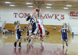 Tomahawk guard Kaitlyn Enberg battles to put the ball up against the Squalicum defense.