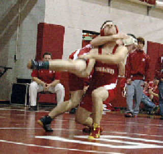 Senior Ryan Mead grabs the leg of his Stanwood opponent.