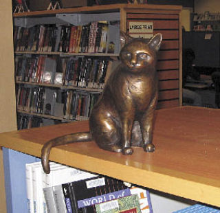 “Library Cat” by Sarah Ohman-Ybarra Lopez and Mark Twain Stevenson features sculptures of nine versions of the same cat. The art project was made possible by the Gellerson Bequest and the Friends of the Marysville Library