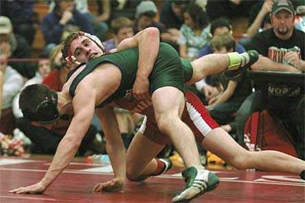 Luke Shumaker wrestles for the 135-pound conference championship.