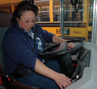 Marysville school bus driver Jacqueline Rojas checks the light system sequence and brakes before heading out on a practice drive on Aug. 24.