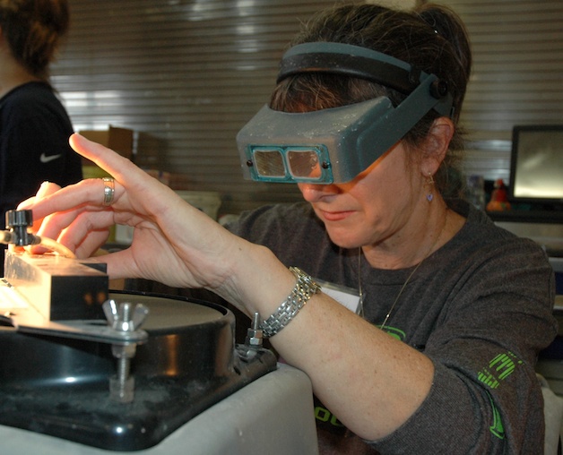 Kathy Woods of Marysville works the grinding wheel at the Marysville Rock & Gem Club’s 40th annual ‘Rocktoberfest.’