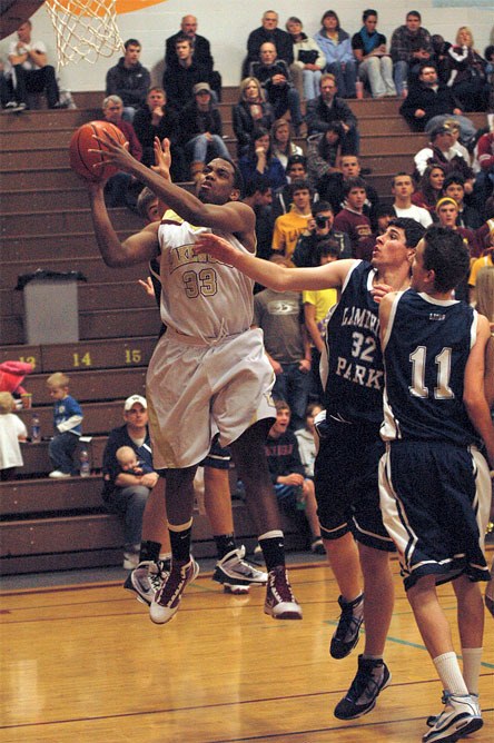 Junior Tre' Haslom drives to the lane