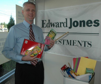 Lance Curry of Edward Jones in Marysville hopes to fill his office's donation box with many more school supplies before Aug. 27.