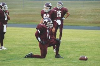 Steven Marquardt rests in between defensive snaps for the Cougars.  Many of the Cougar lineman were forced to play both sides of the ball and deal with the double fatigue.