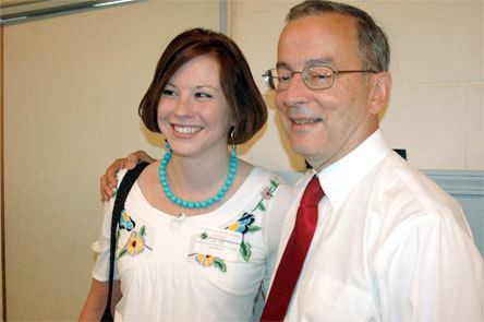 Marysville-Pilchuck High School marketing teacher and DECA advisor Jim Pankiewicz gets a hug from a former student