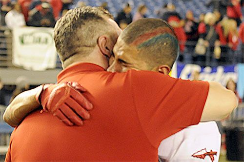 Jaime Hernandez hugs one of his M-P coaches after the Tommies lost 20-10 to Bellevue in the state seminfinal football game Nov. 28.