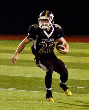 Lakewood running back Donovan Evans runs the ball around the Cubs’ defense during their Friday