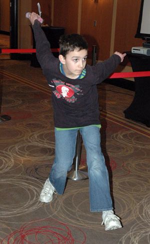 Kyren Warbus tries his hand at Wii bowling to help raise funds for Junior Achievement of Snohomish County at the Tulalip Resort Casino on March 14.