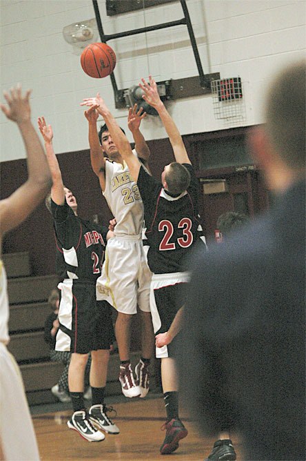 Joseph Hawkins dishes to an open teammate on the perimeter.