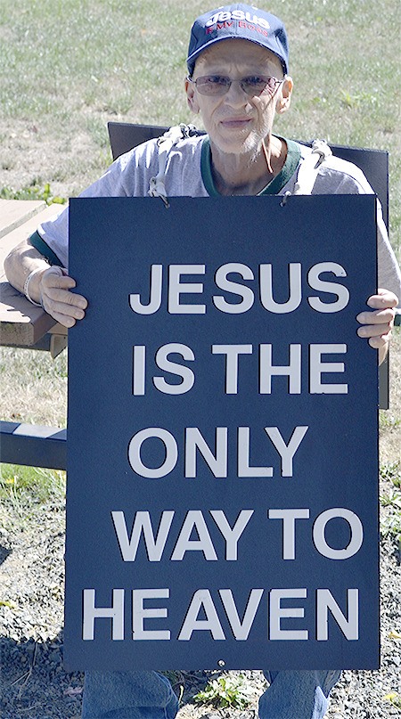 File photo shows Gary Haga of Marysville and his billboard sign near Jennings Park. Haga has died of pancreatic cancer.