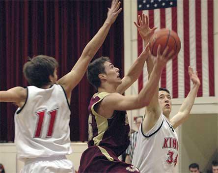 Nathan Hesselman fights his way through the King's defense during the first half.