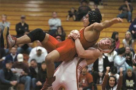 Marysville-Pilchuck Christian Mendoza steadies himself before being brought to the ground by 130-pound opponent Jarred Studley.