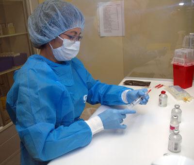 Pharmacists such as Hau Dong mix the chemotherapy drugs just down the hall from where the patients receive their treatments in the Skagit Valley Hospital Regional Cancer Care Center at the Cascade Skagit Health Alliance in Arlington.