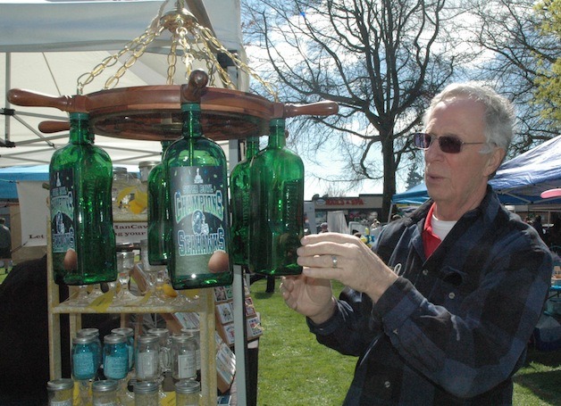 Bob Smith adjusts a handmade chandelier that he helped his son