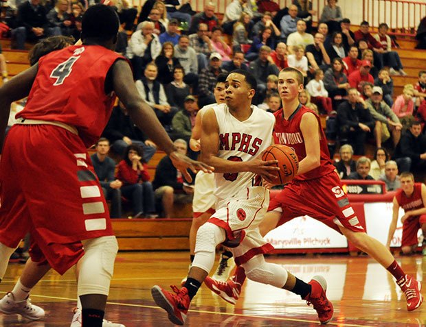 Marysville-Pilchuck's Bryce Juneau drives inside for a layup.