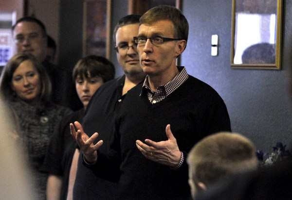 Gubernatorial candidate Rob McKenna speaks to a crowd of Marysville residents during a meet and greet at Coldwell Banker on Saturday