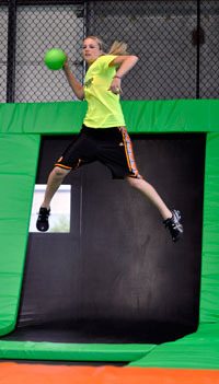 Arlington High School graduate Quinn Kesselring participates in an Xtreme Dodgeball game Monday