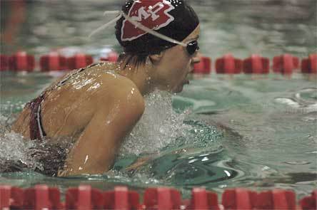 Freshman Hannah Taylor competes in the breast stroke at the District 1 meet.