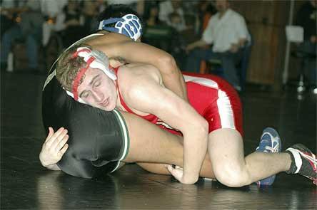 Luke Shumaker brings his opponent to the ground on his way to earning third place at 130 pounds.