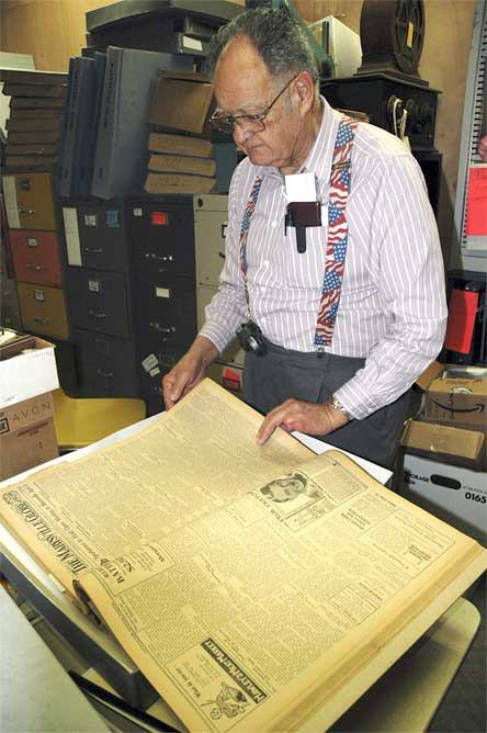 Marysville Historical Society President Ken Cage peruses his archives of  The Marysville Globe from decades past.