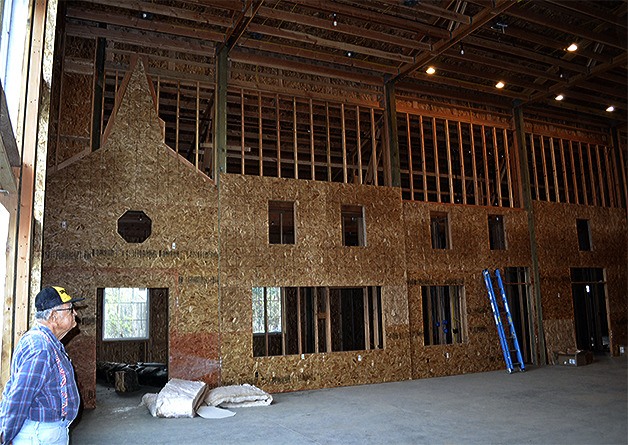 Historical Society president Ken Cage is dwarfed by the enormous Great Hall that is part of the new Marysville museum.